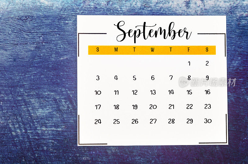 The September 2023 Monthly calendar for 2023 year on old blue wooden background.